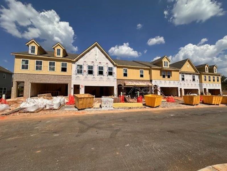 Front exterior of a new home in Wilkins Walk, Mableton, GA, highlighting curb appeal (Image 23). Front exterior of a new home in Wilkins Walk, Mableton, GA, highlighting curb appeal (Image 23).