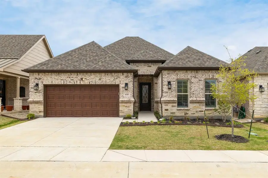 Front exterior of a new home in , Prosper, TX, highlighting curb appeal (Image 2). Front exterior of a new home in , Prosper, TX, highlighting curb appeal (Image 2).