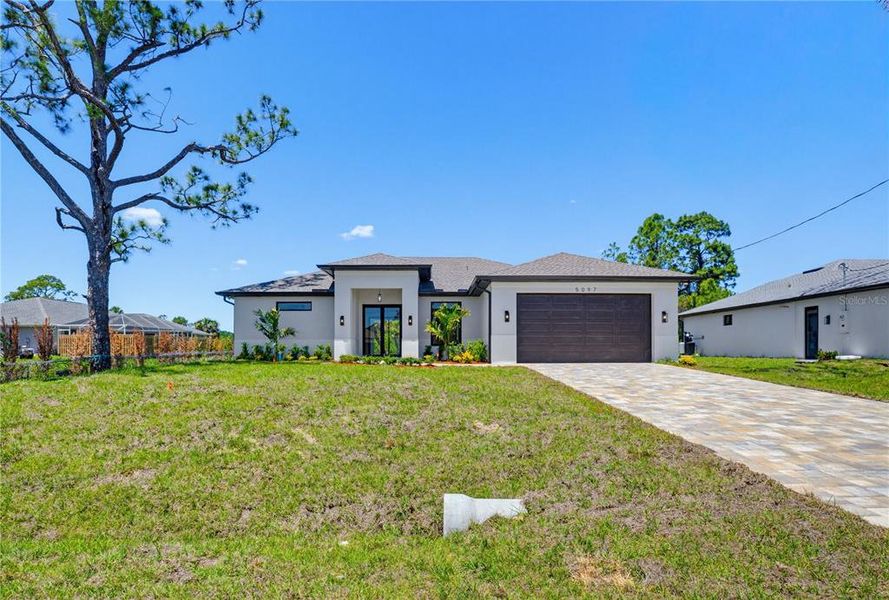 Front exterior of a new home in , North Port, FL, highlighting curb appeal (Image 24).