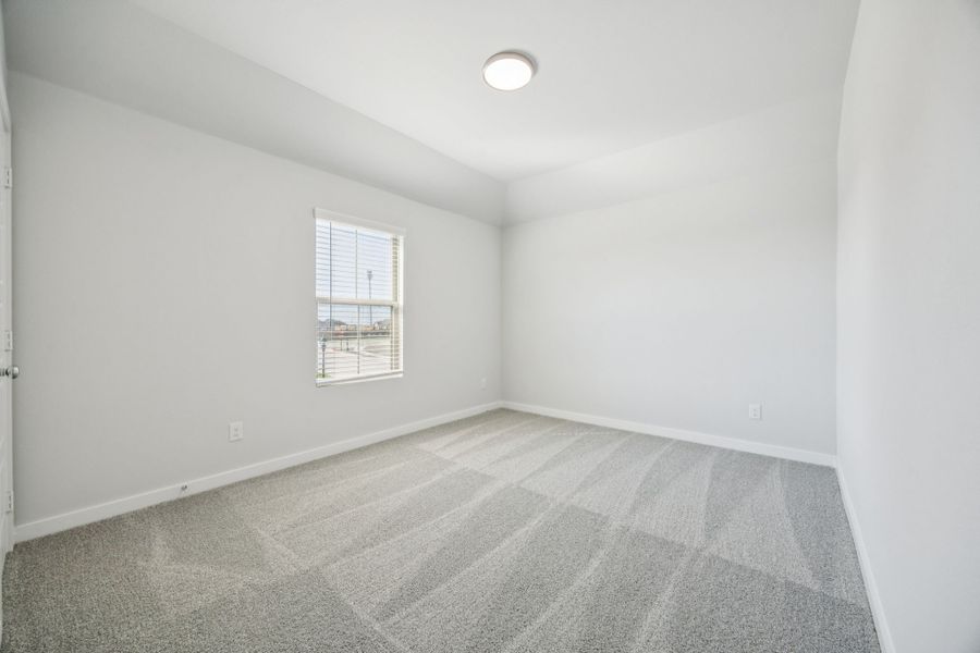 Bedroom in the Masters home plan by Trophy Signature Homes – REPRESENTATIVE PHOTO