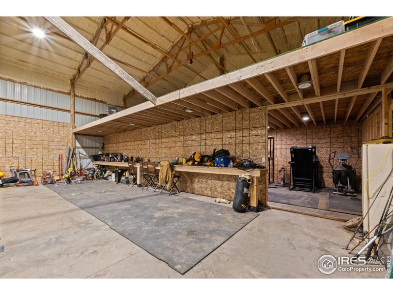 Spacious 40' x 19' loft inside the shop, providing ample overhead storage and keeping equipment and supplies organized and out of the way.