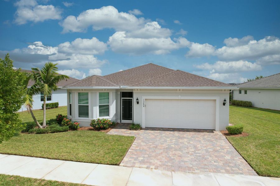Front exterior of a new home in , Port St. Lucie, FL, highlighting curb appeal (Image 21).