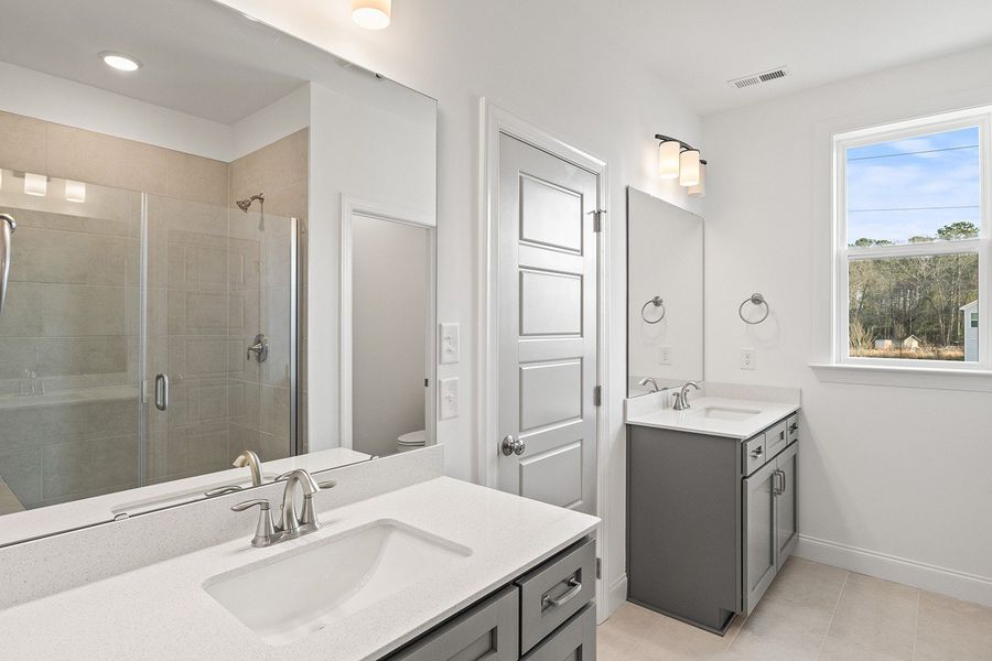 Representative furnished interior of a home built from the The Whitley by RobuckHomes in Kennebec Crossing, Angier (Image 11).