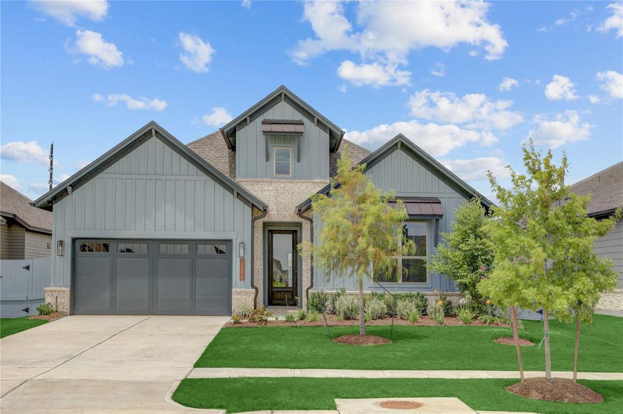 Front exterior of a new home in Fulshear Lakes Gardens, Fulshear, TX, highlighting curb appeal (Image 2). Front exterior of a new home in Fulshear Lakes Gardens, Fulshear, TX, highlighting curb appeal (Image 2).