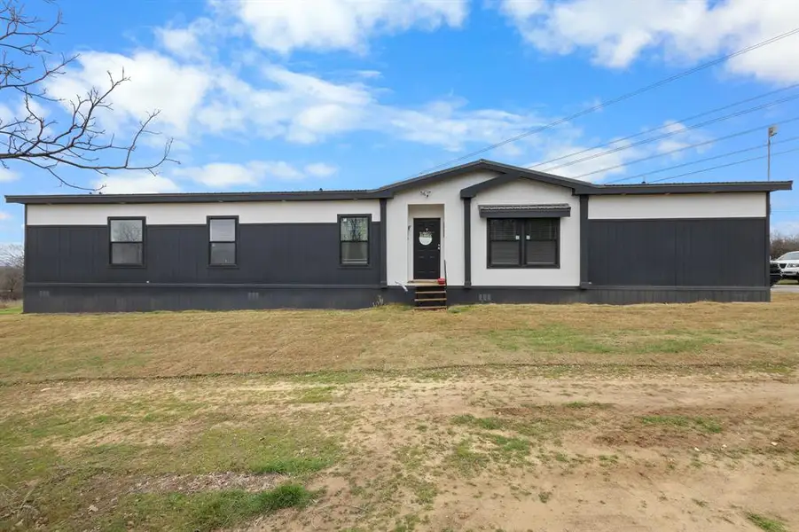 Front exterior of a new home in , Decatur, TX, highlighting curb appeal (Image 2). Front exterior of a new home in , Decatur, TX, highlighting curb appeal (Image 2).