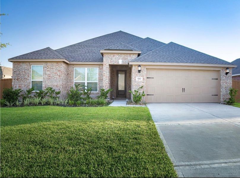 Front exterior of a new home in Lago Mar, Texas City, TX, highlighting curb appeal (Image 1). Front exterior of a new home in Lago Mar, Texas City, TX, highlighting curb appeal (Image 1).