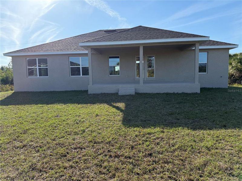 Front exterior of a new home in South Gulf Cove, Port Charlotte, FL, highlighting curb appeal (Image 10).