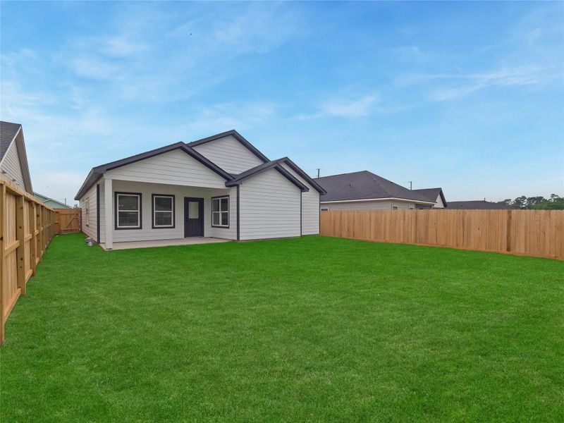 Exterior details and patio area of a home in Hill & Dale Ranch, Splendora (Image 3).