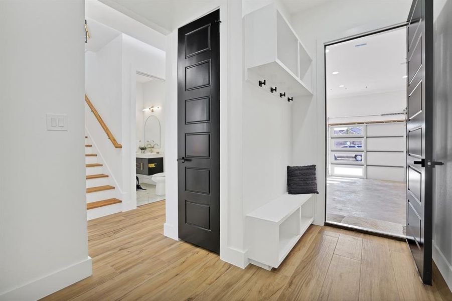 Mudroom with light wood-type flooring