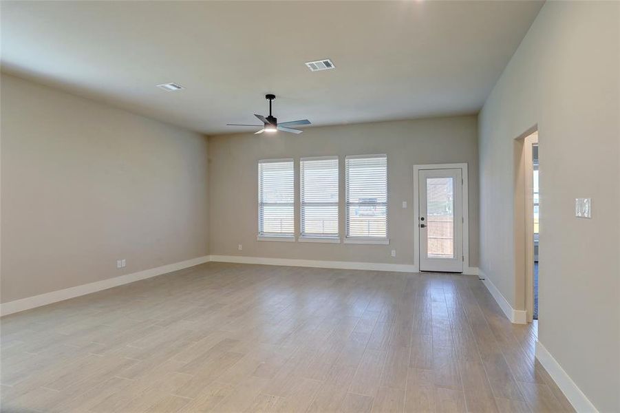 Spare room with light wood-type flooring and ceiling fan Spare room with light wood-type flooring and ceiling fan