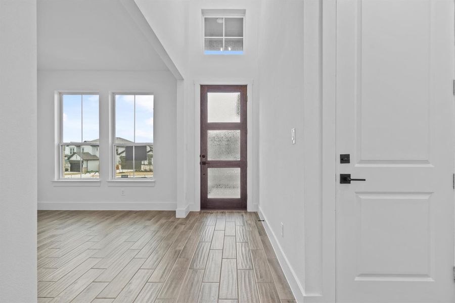 Foyer with a towering ceiling