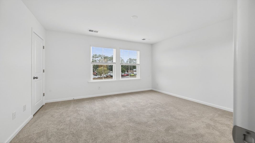 Bedroom with lots of natural light Hayden Floorplan at Clear Springs Townhomes