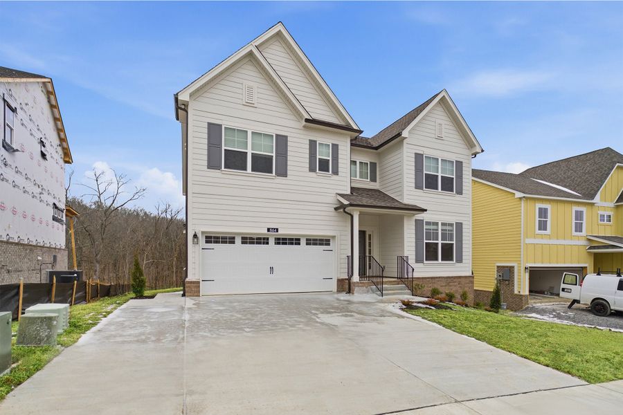 Front exterior of a new home in The Retreat at Norman Farm, Hendersonville, TN, highlighting curb appeal (Image 26). Front exterior of a new home in The Retreat at Norman Farm, Hendersonville, TN, highlighting curb appeal (Image 26).