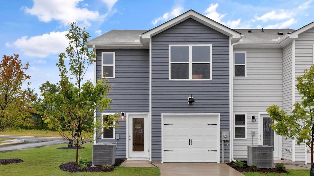Representative exterior photo of a completed home built from the Pearson ll by D.R. Horton in The Townes at Matthews Landing, Fuquay Varina, NC (Image 23).