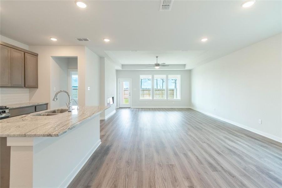 The foyer leads to a bright great room, casual dining area, and a chef-inspired kitchen