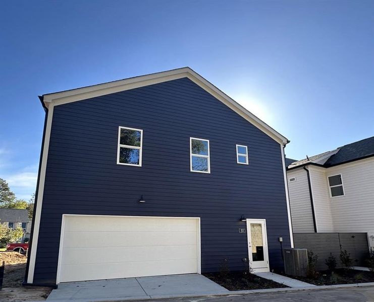 Front exterior of a new home in Harmony, Auburn, GA, highlighting curb appeal (Image 24). Front exterior of a new home in Harmony, Auburn, GA, highlighting curb appeal (Image 24).