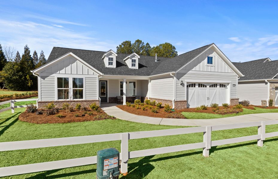 Front exterior of a new home in Sun City Peachtree, Griffin, GA, highlighting curb appeal (Image 25). Front exterior of a new home in Sun City Peachtree, Griffin, GA, highlighting curb appeal (Image 25).