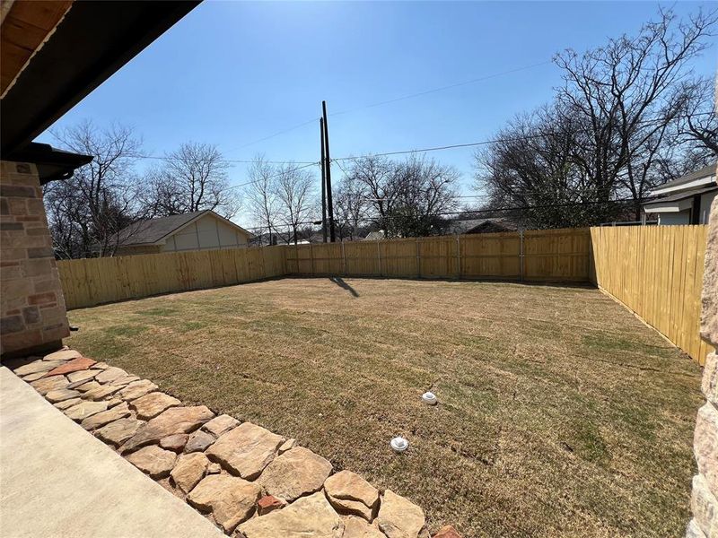 View of fenced backyard