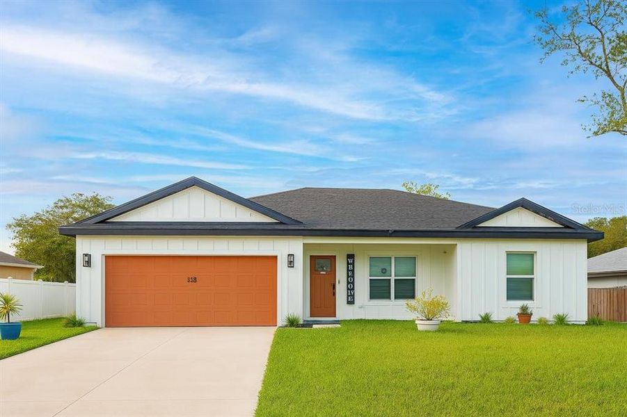 Front exterior of a new home in , Deltona, FL, highlighting curb appeal (Image 18).