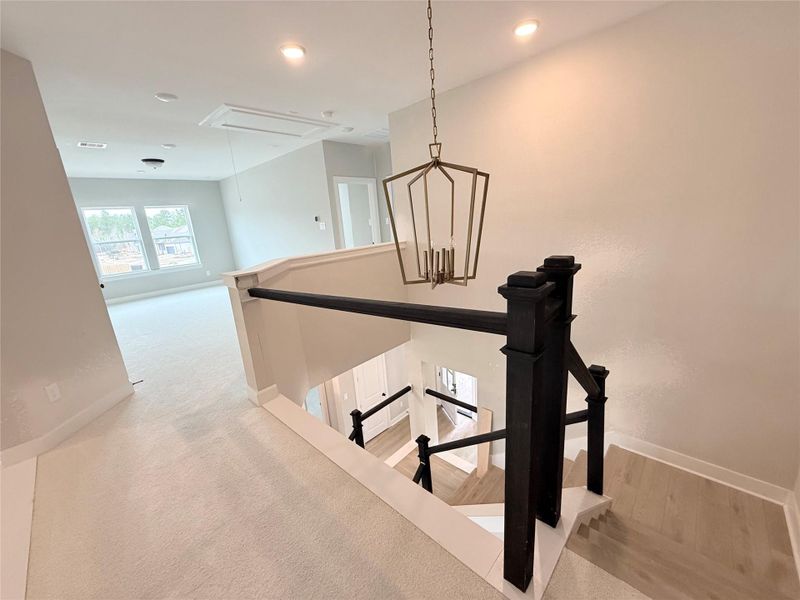 Designer light fixture compliments stairwell that opens onto the retreat/game room at 2nd floor!