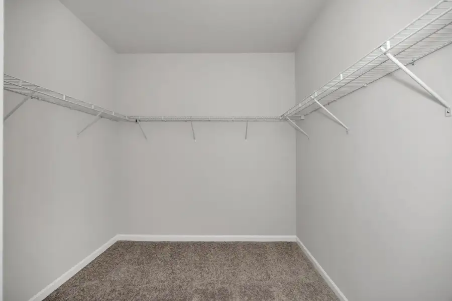 The Avery- Primary Walk-In Closet. Sample image for illustration; upgrades, options, and colors may vary.