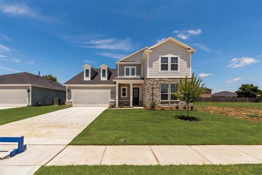 Front exterior of a new home in Creekside of Crowley, Crowley, TX, highlighting curb appeal (Image 22).