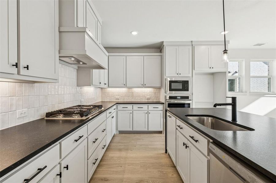 Beautiful cabinetry and gorgeous counter tops effortlessly blend with contemporary stainless steel to create the kitchen of your dreams!