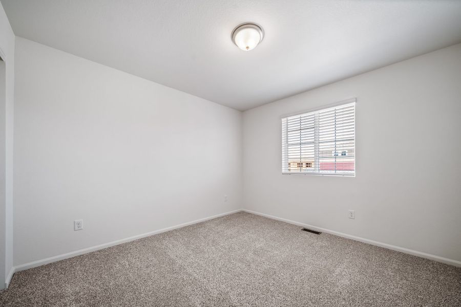 Spacious, unfurnished interior of a new home in Reunion, Commerce City (Image 14).