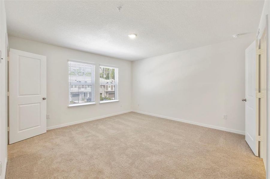Spacious, unfurnished interior of a new home in Towns at Riverwalk, Sanford (Image 16).