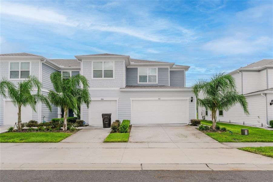 Front exterior of a new home in Belle Haven, Davenport, FL, highlighting curb appeal (Image 2).