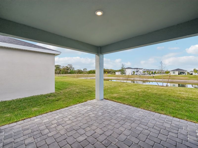 Exterior details and patio area of a home in Brystol at Wylder - Reserve Series, Port St. Lucie (Image 3).
