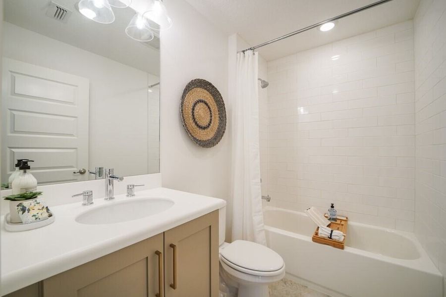 Furnished interior in a model home at The Enclaves at Festival Cove in Davenport (Image 22).