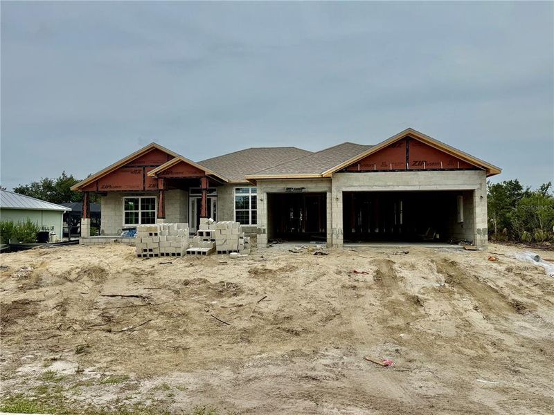 Front exterior of a new home in South Gulf Cove, Port Charlotte, FL, highlighting curb appeal (Image 18).
