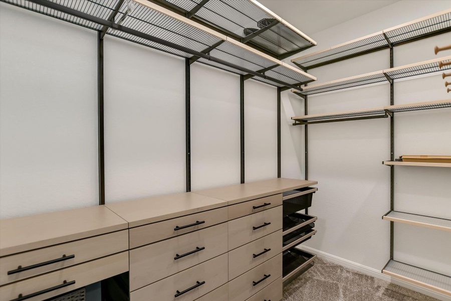 Enjoy"His" and "Hers" Primary walk-in closets, with ELFA® closet systems!