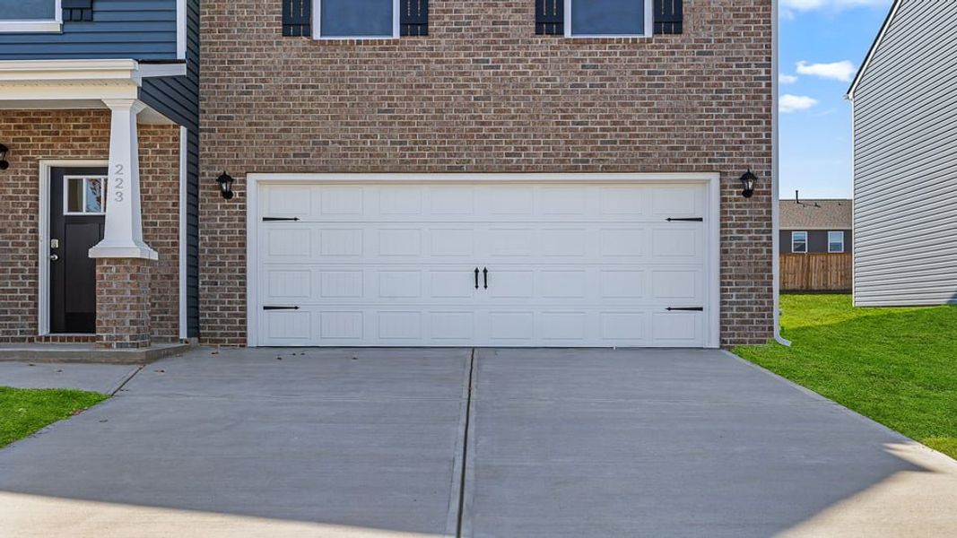 Exterior details and patio area of a home in Durbin Meadows Traditions, Fountain Inn (Image 3).