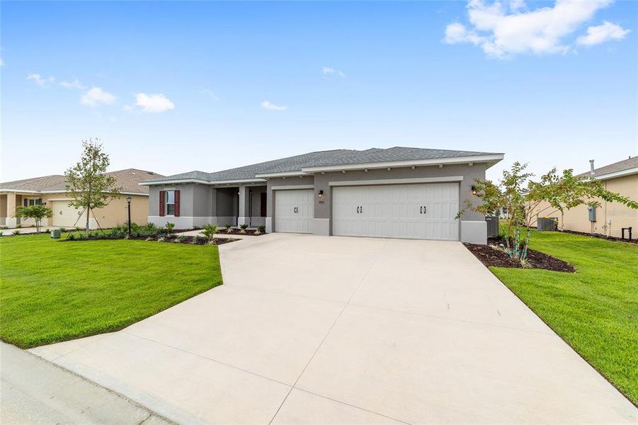 Front exterior of a new home in On Top of the World Communities, Ocala, FL, highlighting curb appeal (Image 2). Front exterior of a new home in On Top of the World Communities, Ocala, FL, highlighting curb appeal (Image 2).