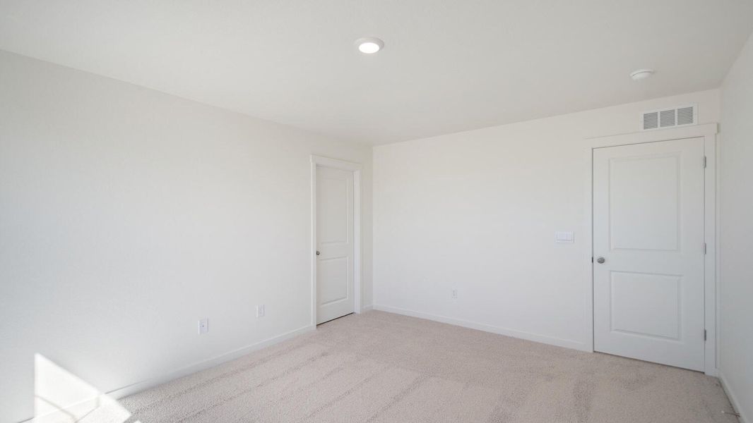 Spacious, unfurnished interior of a new home in The Ridge at Lorson Ranch, Colorado Springs (Image 11).