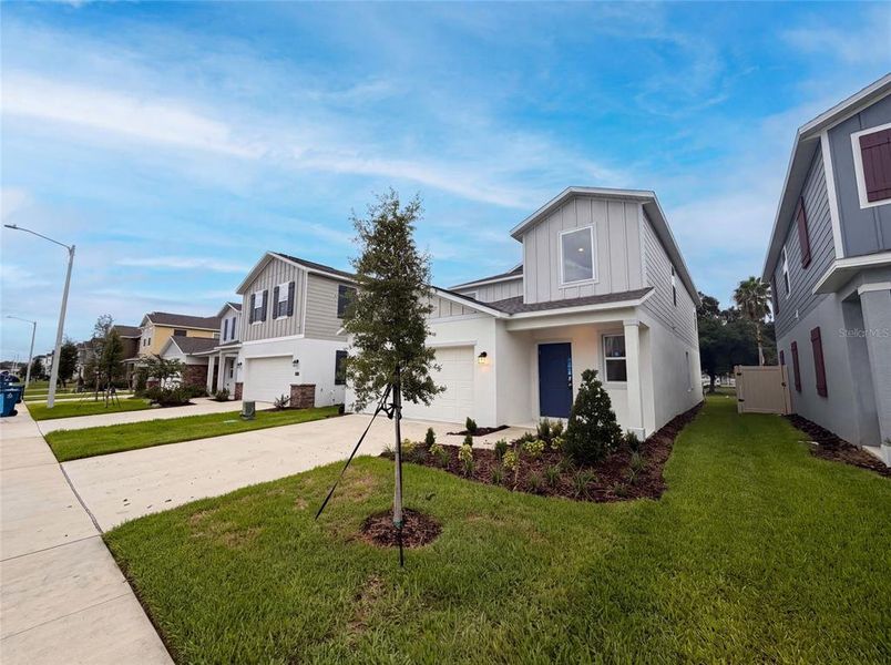 Front exterior of a new home in Wynnstone, Davenport, FL, highlighting curb appeal (Image 2). Front exterior of a new home in Wynnstone, Davenport, FL, highlighting curb appeal (Image 2).