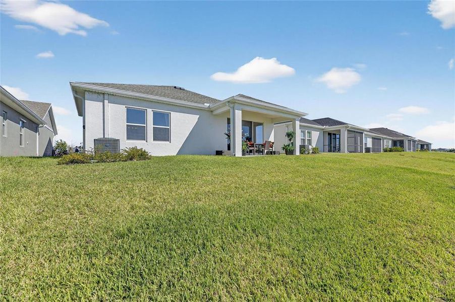 Exterior details and patio area of a home in The Peninsula at Rhodine Lake, Riverview (Image 20).