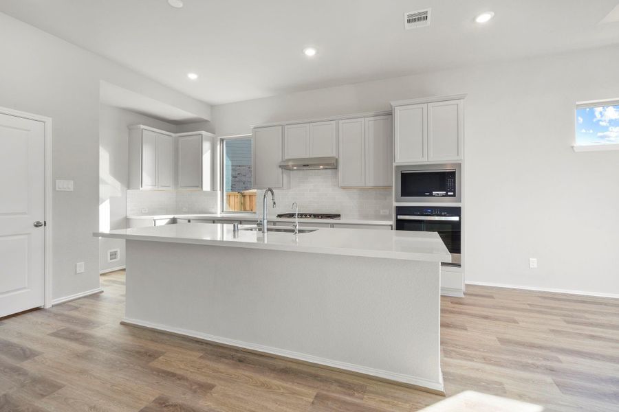 Furnished interior view inside a new home in Dunham Pointe 50', Cypress (Image 10).