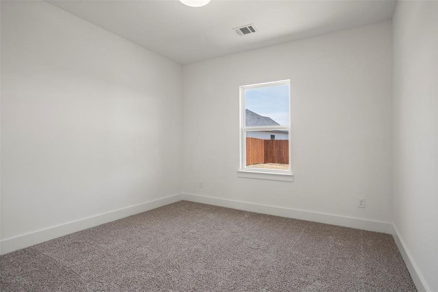 Empty room with carpet floors