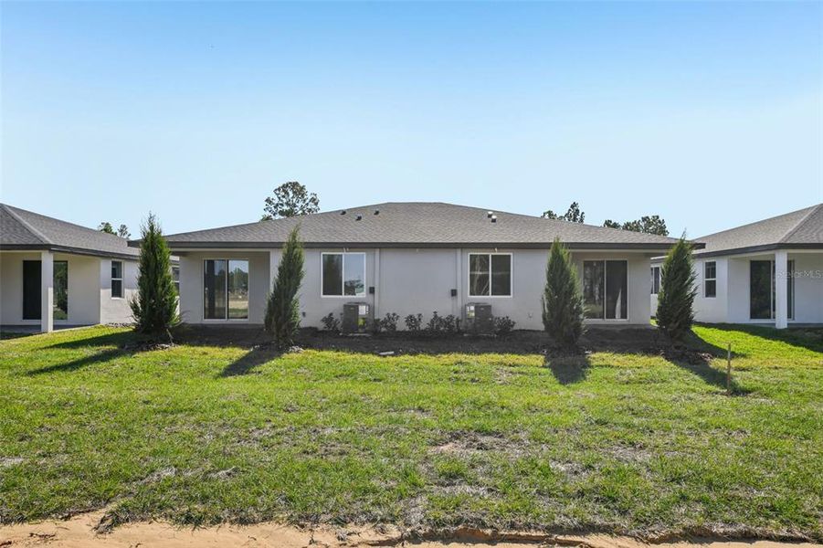 Exterior details and patio area of a home in Ridgehaven - Villas, Ormond Beach (Image 20).