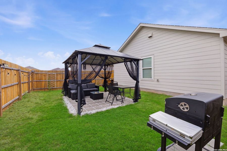 Exterior details and patio area of a home in Spring Grove, St. Hedwig (Image 23).