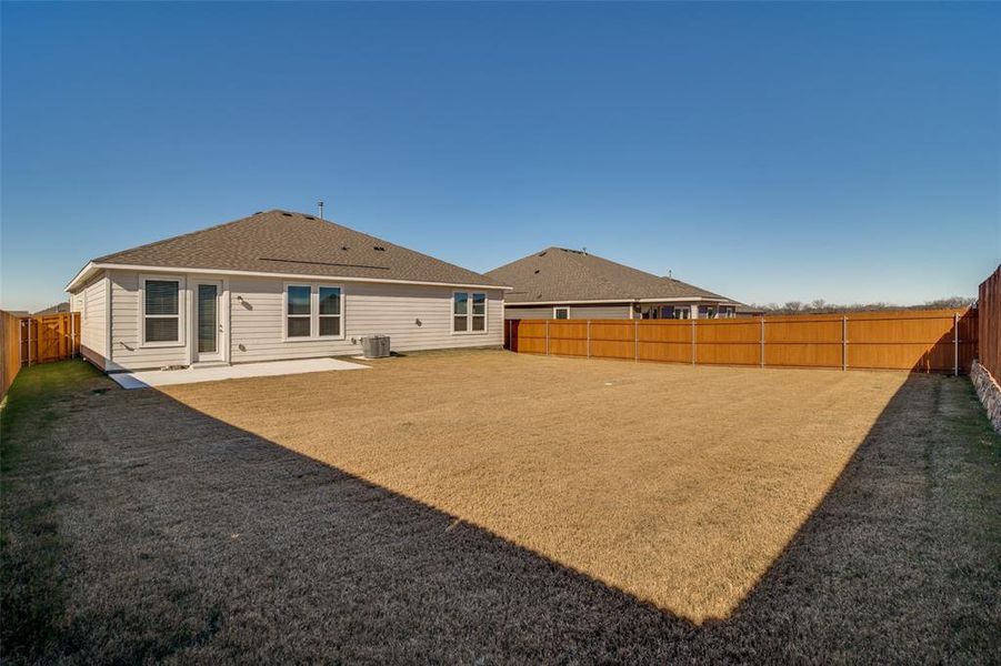 Exterior details and patio area of a home in Heartland Signature, Crandall (Image 3).