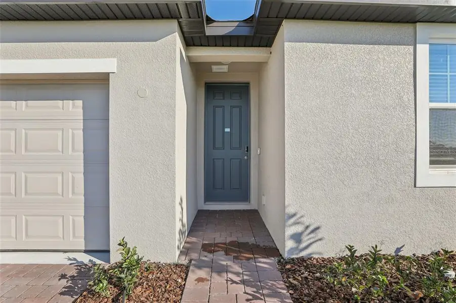 Exterior details and patio area of a home in Bradbury Creek - Signature Series, Haines City (Image 3).