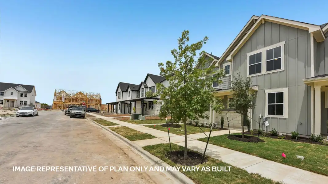 Front exterior of a new home in Avery Centre, Round Rock, TX, highlighting curb appeal (Image 22). Front exterior of a new home in Avery Centre, Round Rock, TX, highlighting curb appeal (Image 22).