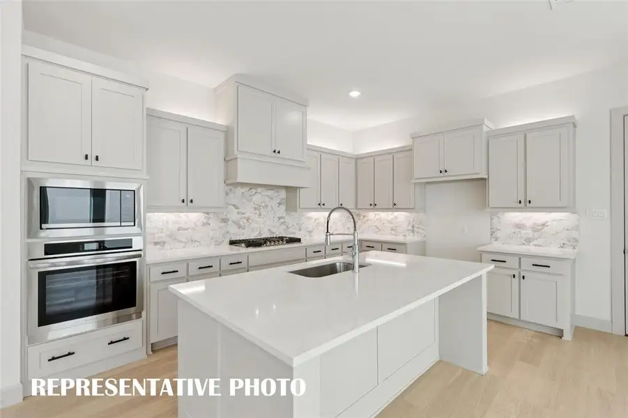 The spacious kitchen island creates the perfect place for friends and family to gather round.  REPRESENTATIVE PHOTO