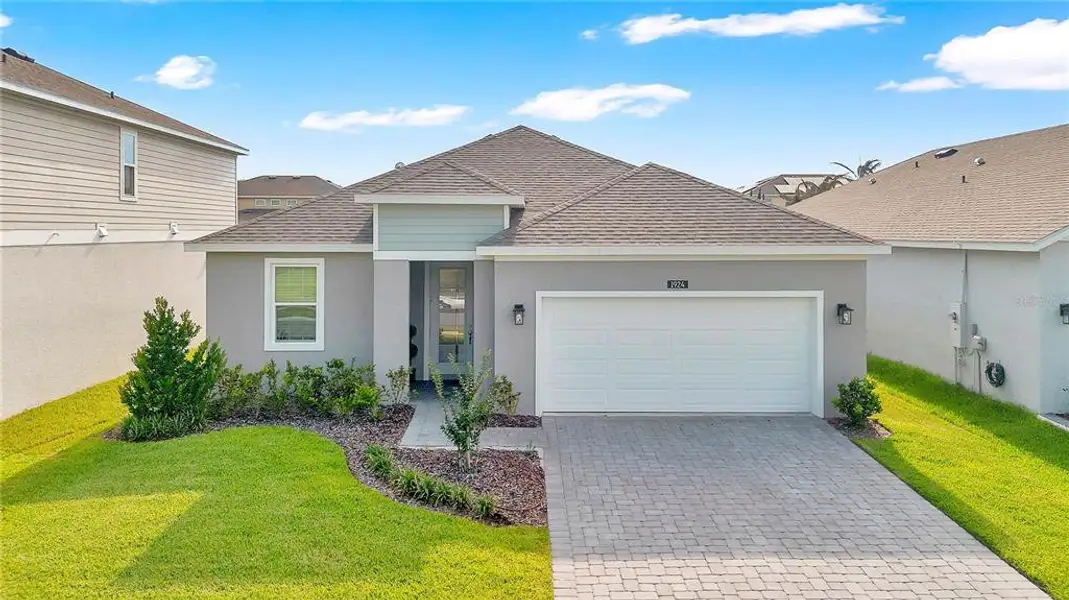 Front exterior of a new home in , St. Cloud, FL, highlighting curb appeal (Image 25).