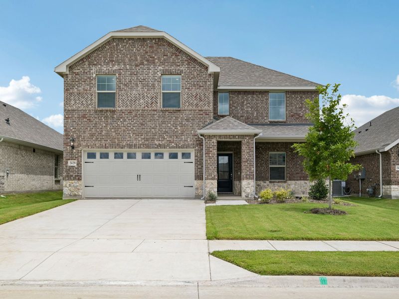 Front exterior of a new home in Parks at Foster Crossing - Signature Series, Anna, TX, highlighting curb appeal (Image 1). Front exterior of a new home in Parks at Foster Crossing - Signature Series, Anna, TX, highlighting curb appeal (Image 1).