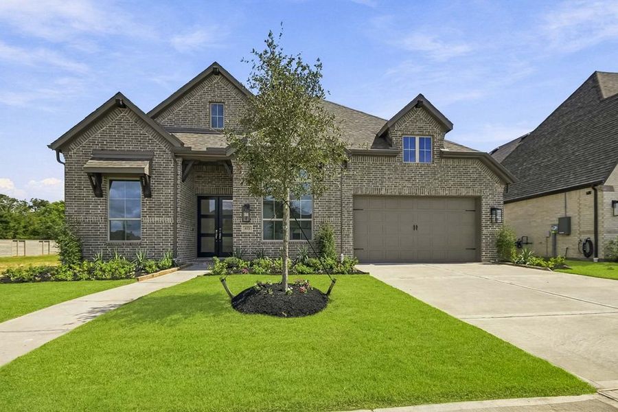 Front exterior of a new home in Legacy, League City, TX, highlighting curb appeal (Image 1). Front exterior of a new home in Legacy, League City, TX, highlighting curb appeal (Image 1).
